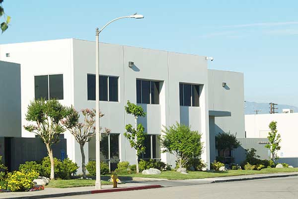Modern white commercial building with a flat roof